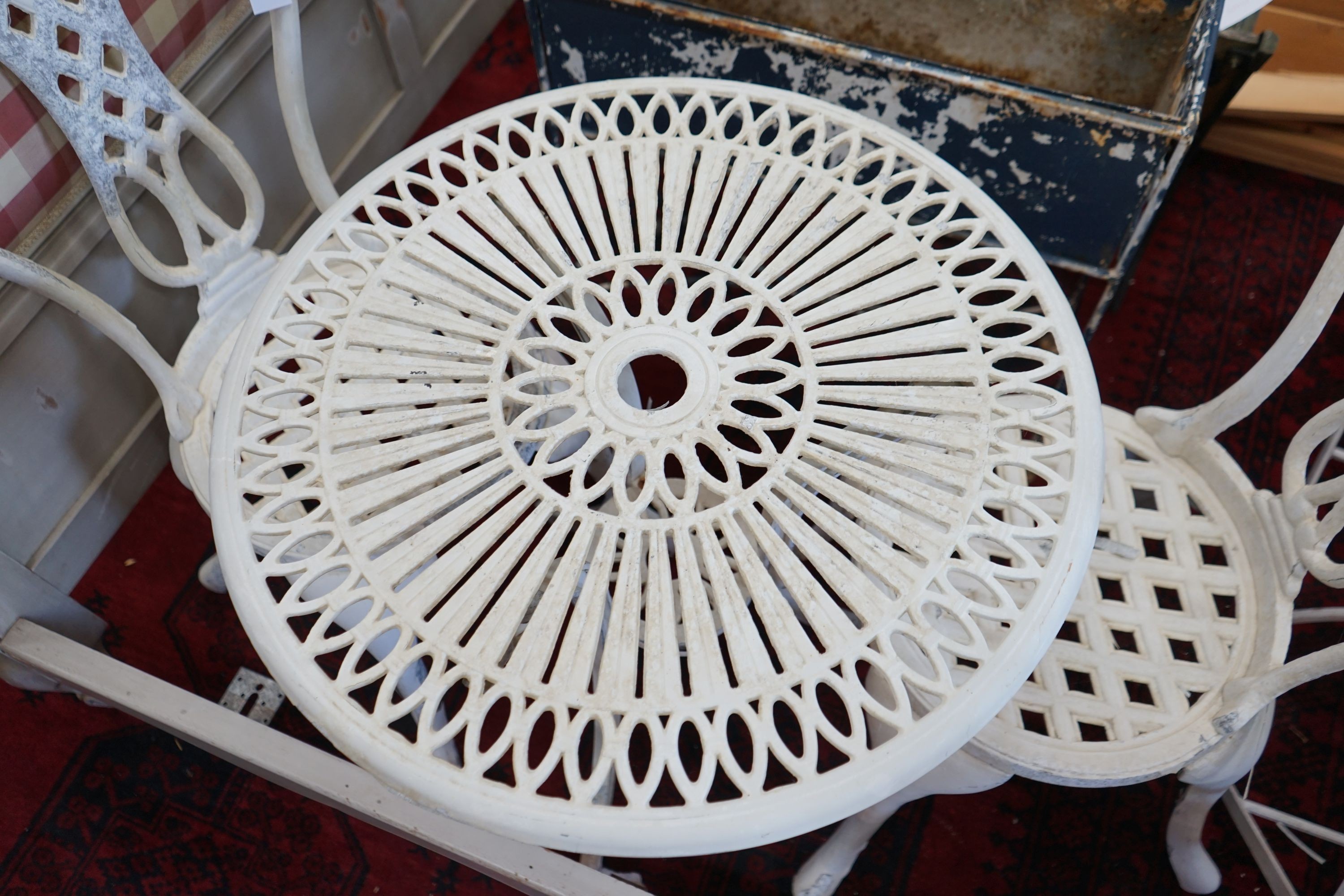 A circular aluminium garden table, diameter 60cm, height 65cm and two chairs